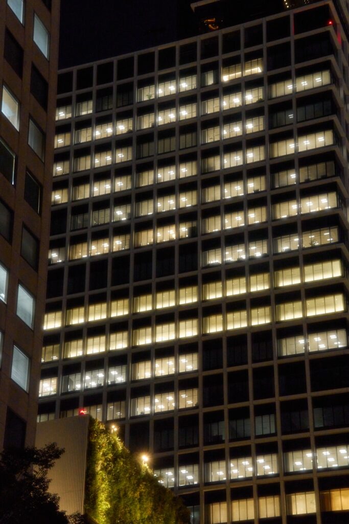 Modern office building with illuminated windows at night