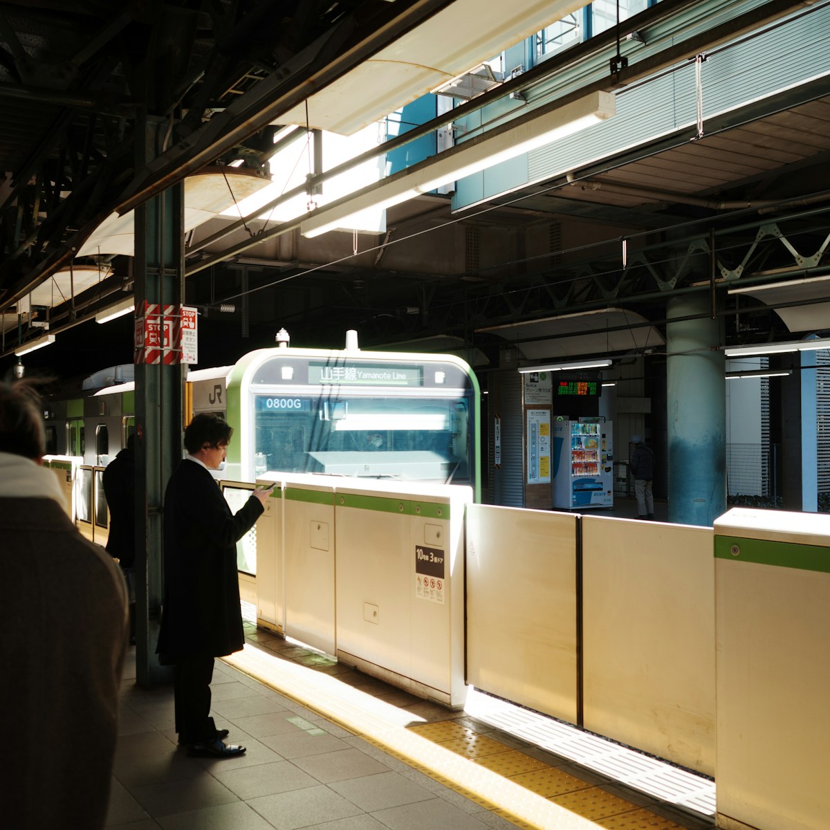 People waiting on a train platform