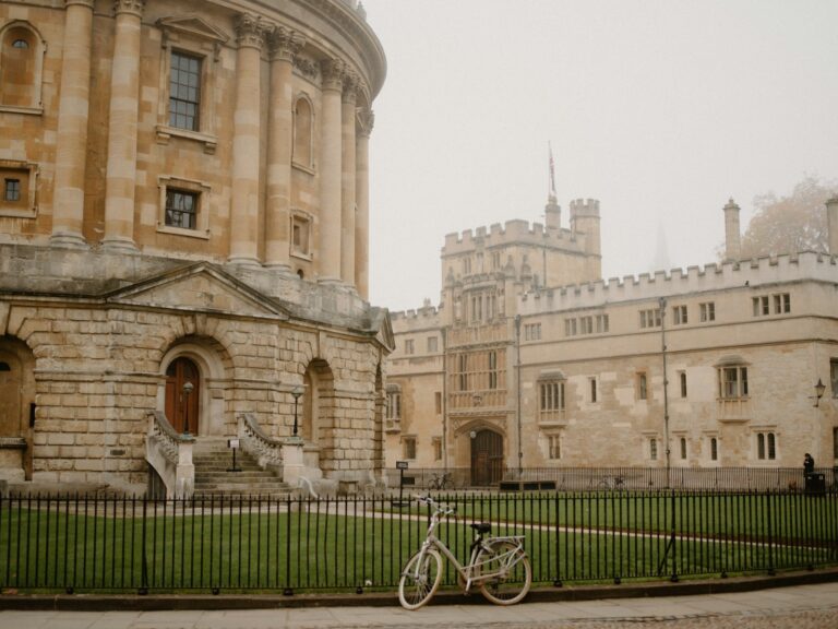 Historic building with a bicycle on a foggy day