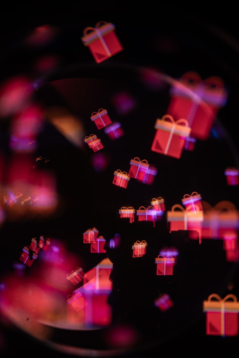 Red gift boxes floating on a dark background