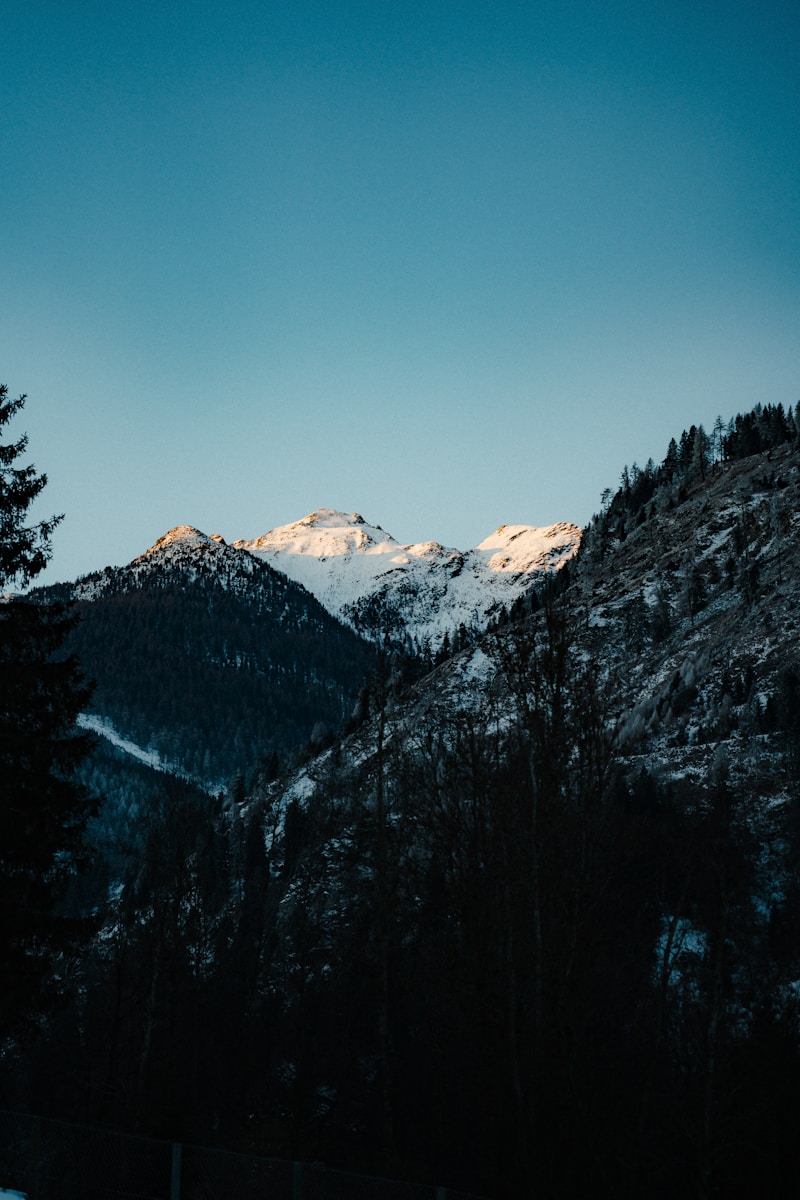 Snow-capped mountains under a clear blue sky