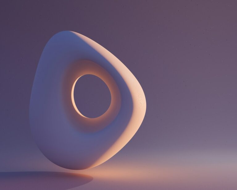 Abstract white shape with a hole in the middle.